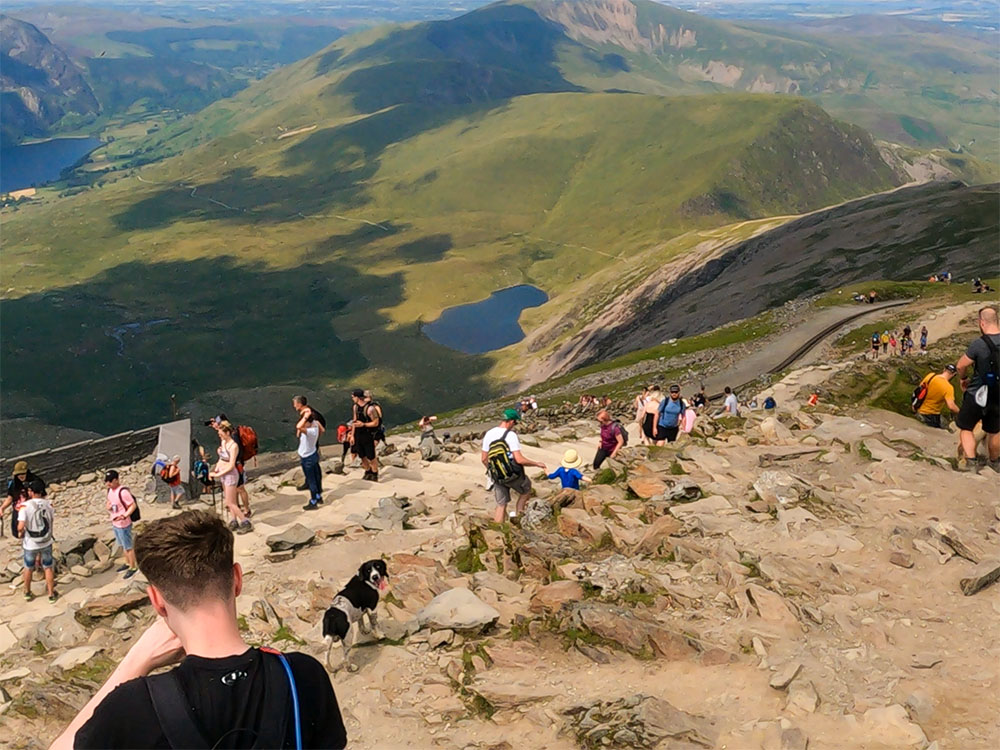 A busy Snowdon summit, with many people having taken the train from Llanberis to the top