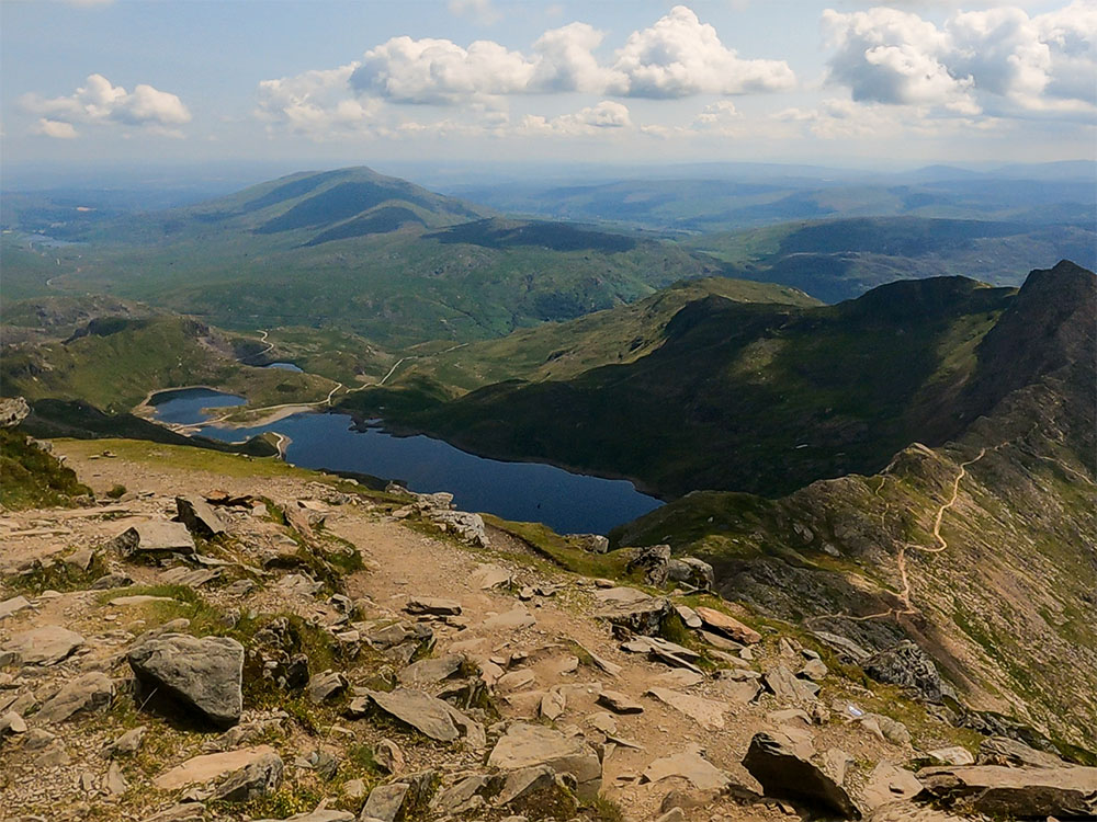 Looking east from Snowdon's summit, with the Miner's Path visible heading over the causeway on the left-hand side of the Llyn Llydaw reservoir down below