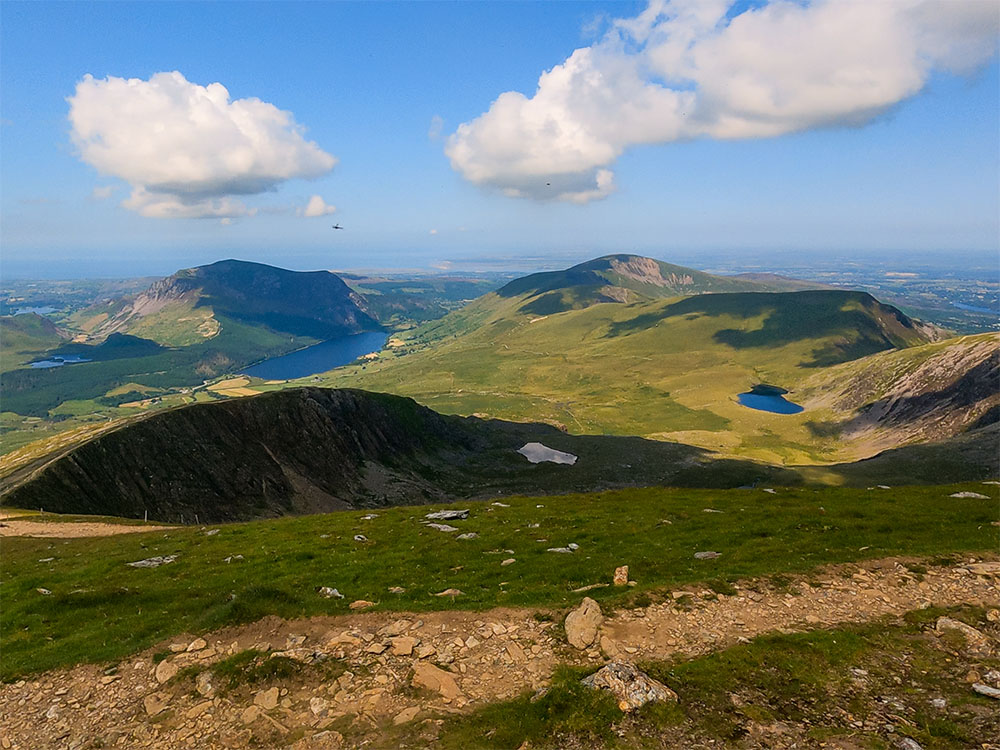 Looking north-west from the Rhyd Ddu path on Snowdon with Anglesey in the distance