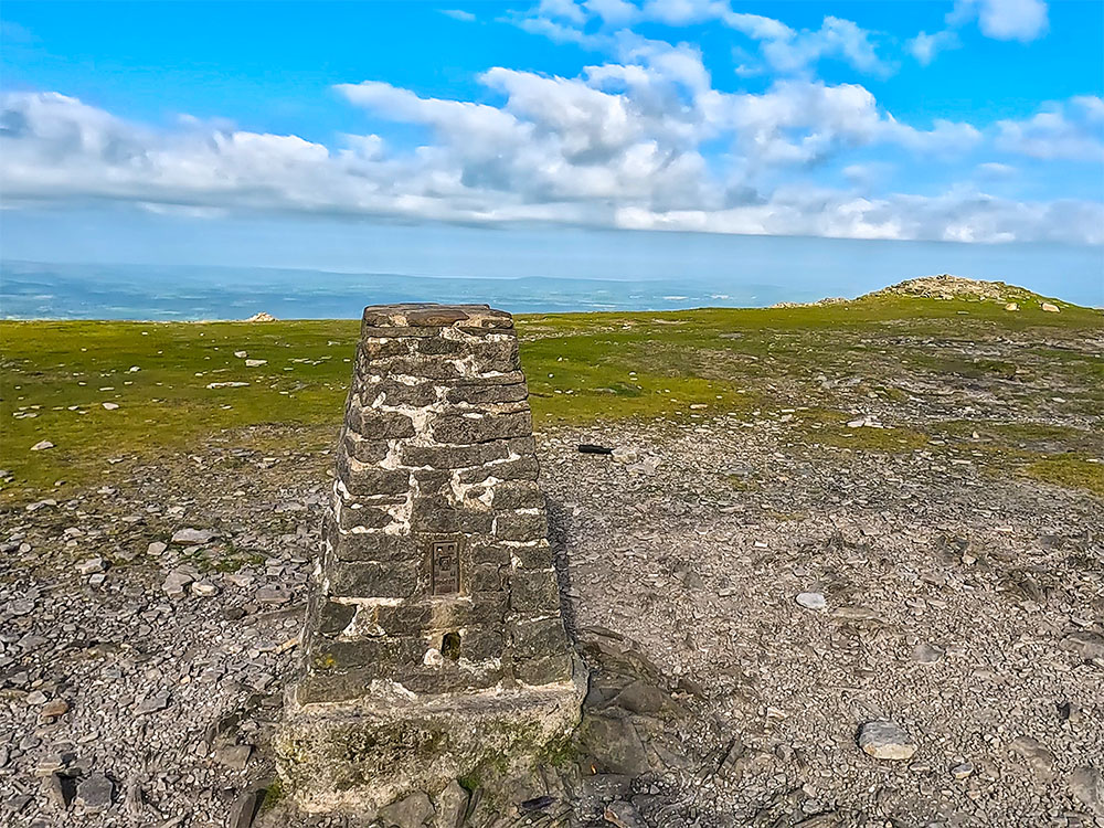 Looking out west towards Morecambe Bay from the trig point on Ingleborough's summit