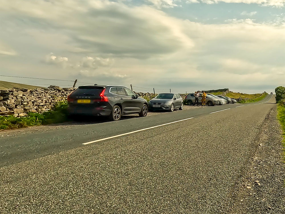 The small layby that affords some parking near the Old Hill Inn