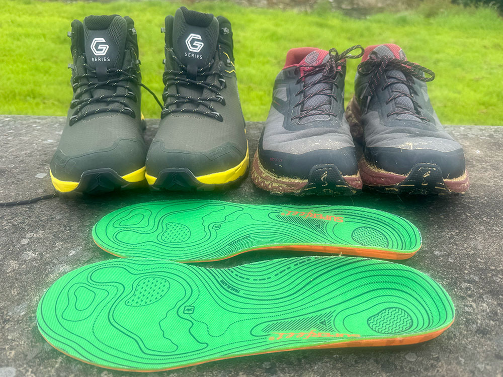 Hiking boots, hiking shoes and a pair of Superfeet hiking insoles