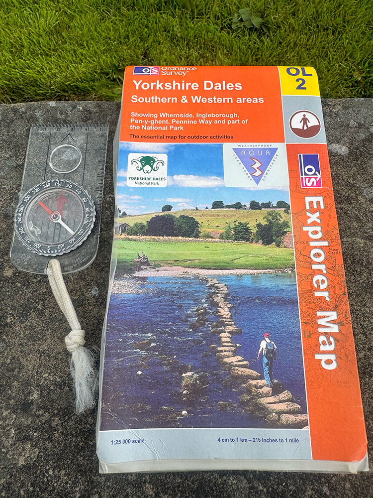 Ordnance Survey Yorkshire Dales southern and western area map covering the Yorkshire Three Peaks and a compass