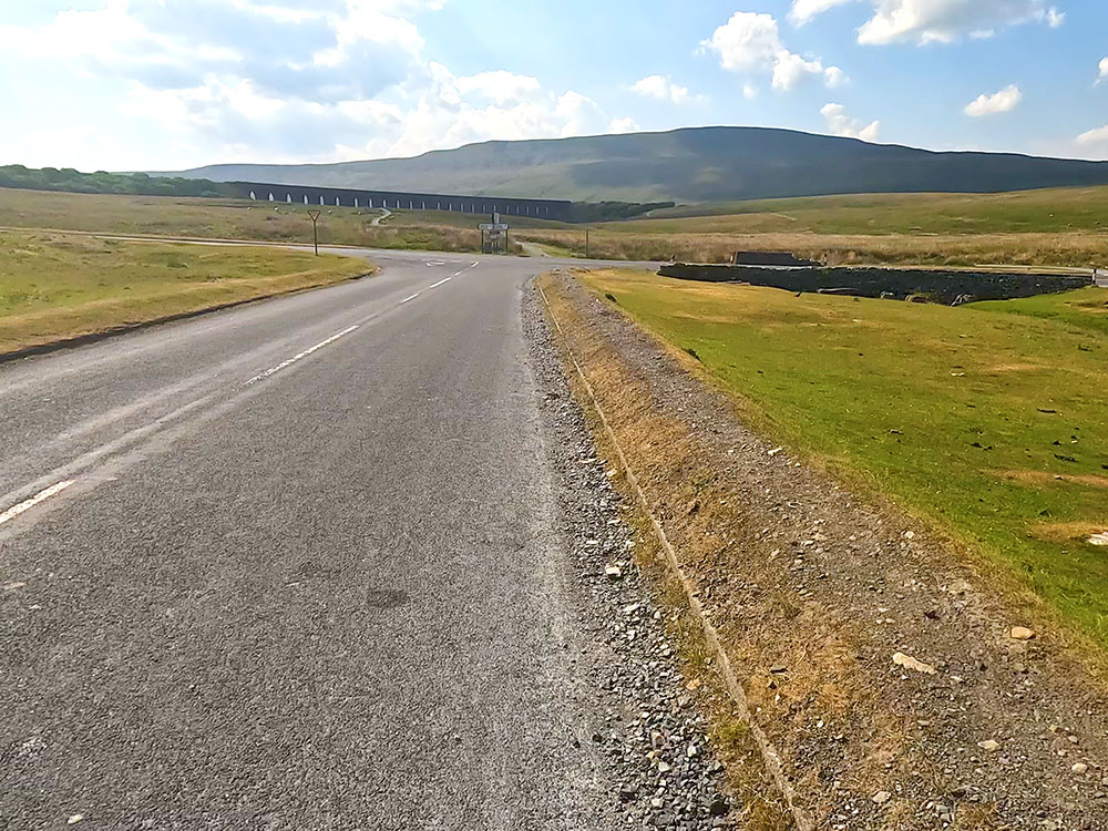 Approaching the T-junction at Ribblehead, with the Ribblehead Viaduct and Whernside ahead