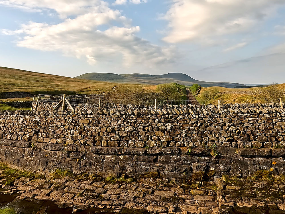 Ingleborough and the Settle to Carlisle railway line from the aqueduct