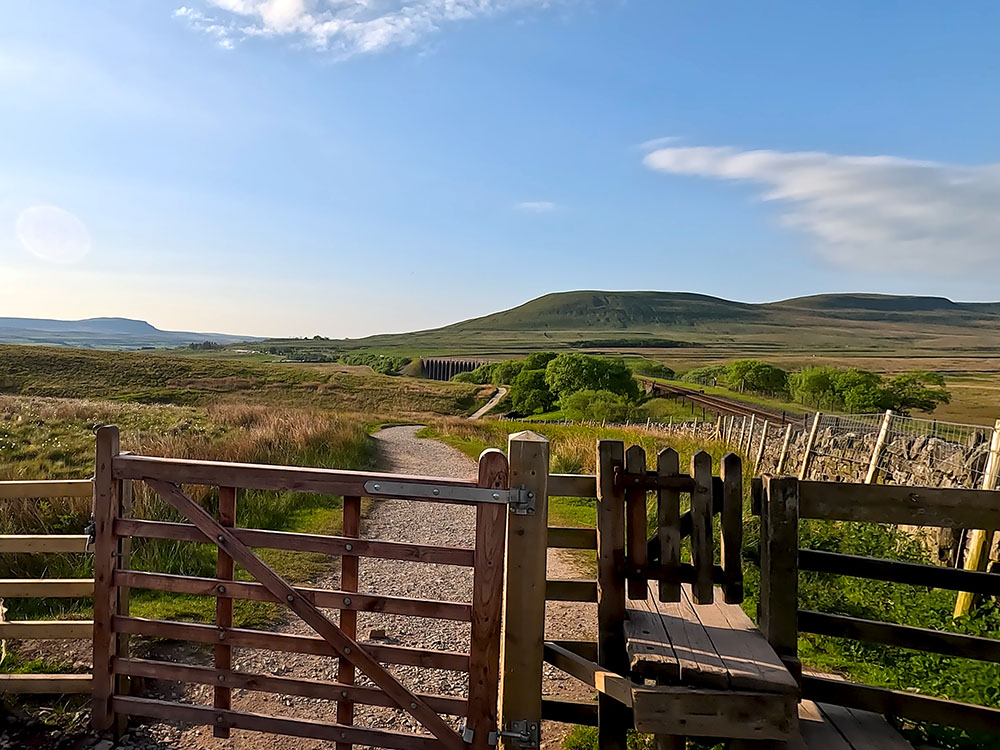 Looking back over the gate towards Pen-y-ghent and Ingleborough