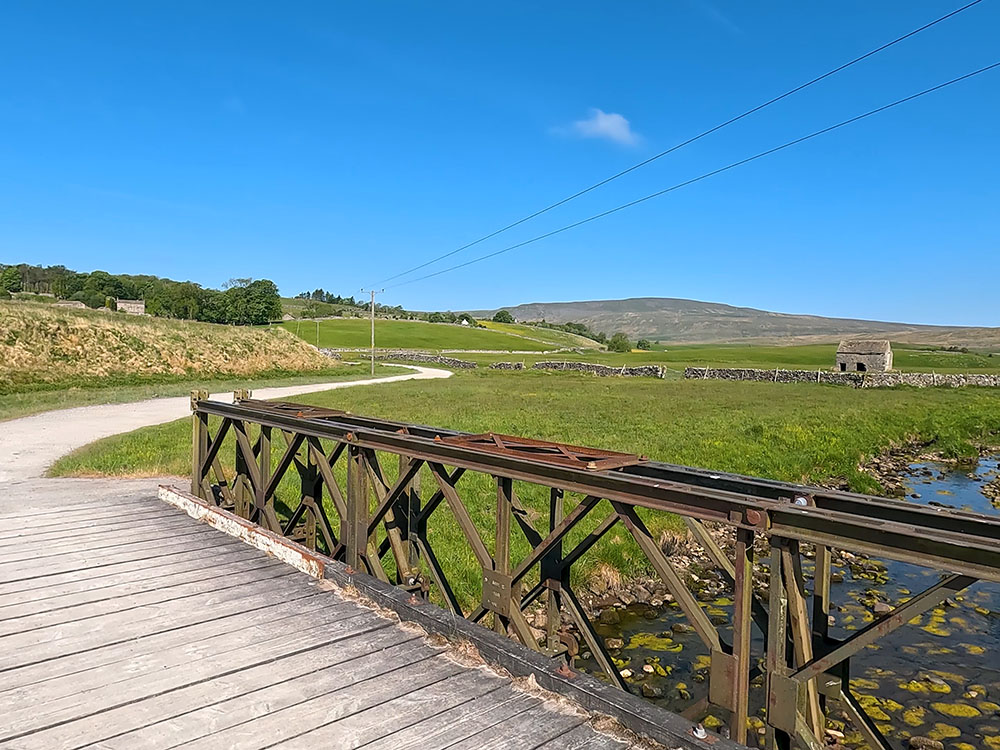 Passing over the wooden footbridge