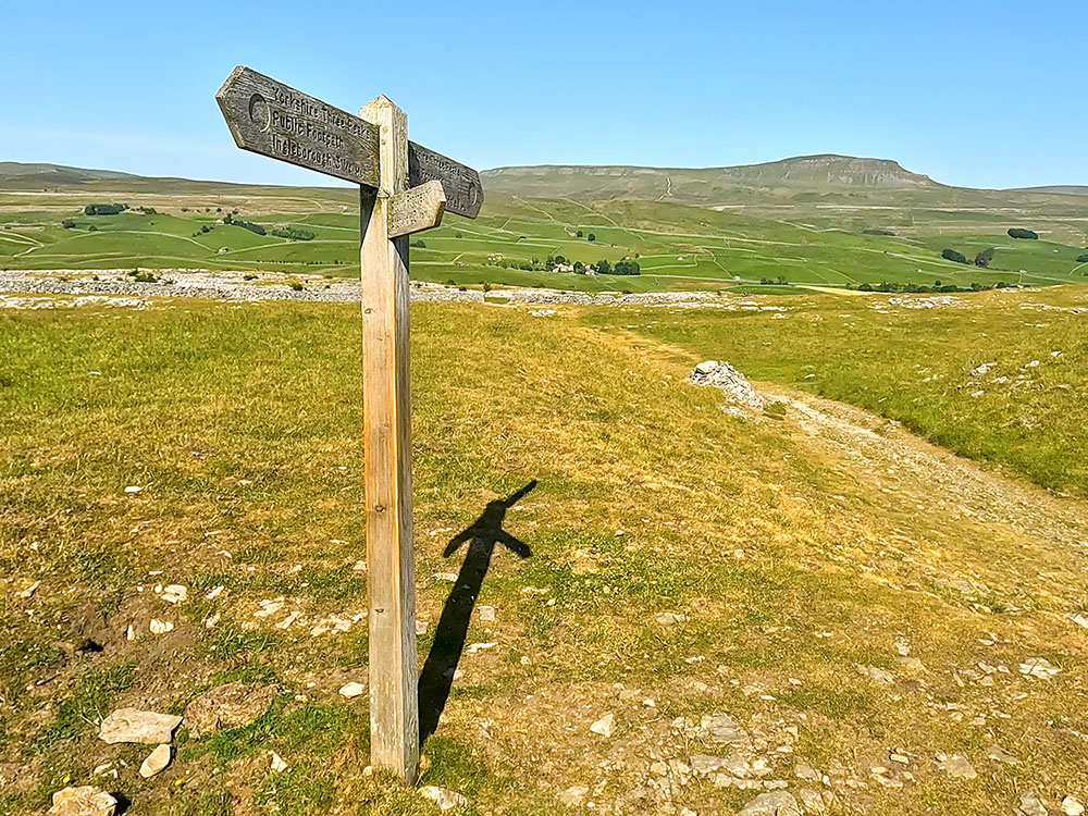 Continue straight on at the Yorkshire 3 Peaks footpath sign