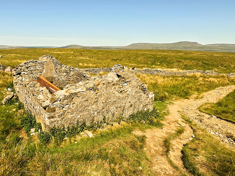 The Yorkshire 3 Peaks path passing by the shooting hut
