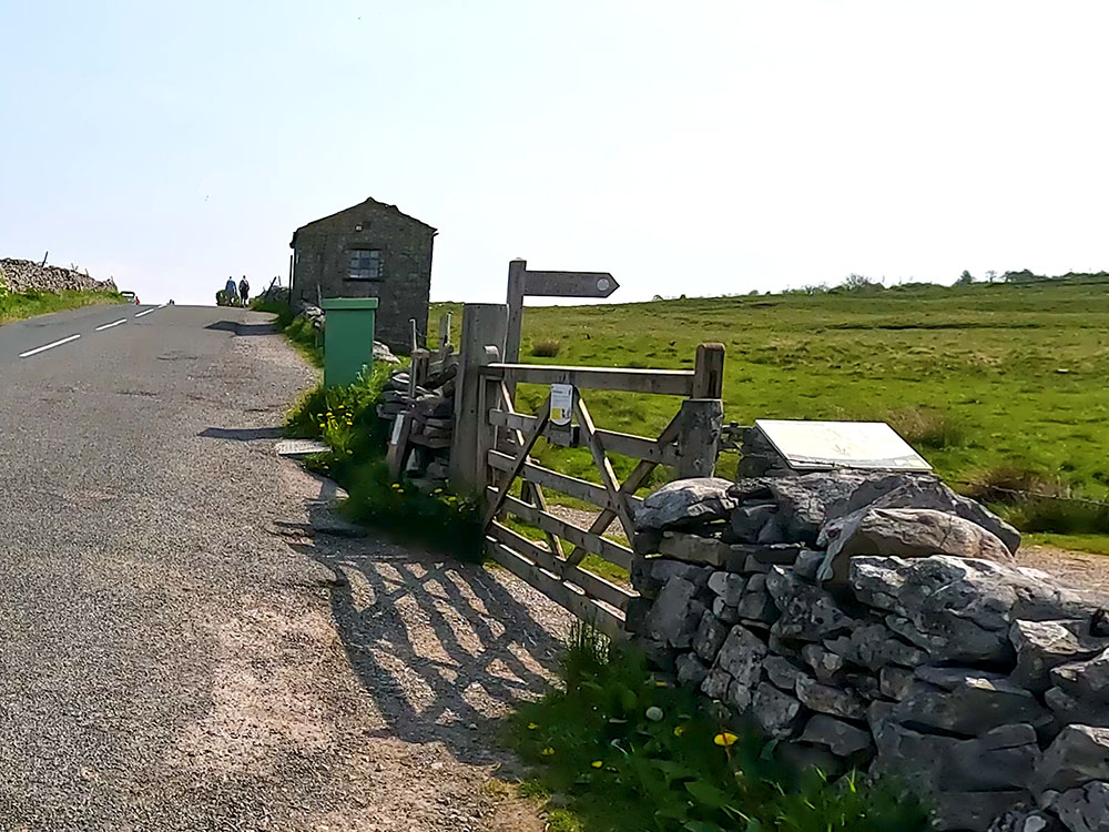 The right turn off the road just before the building to follow the path towards Ingleborough
