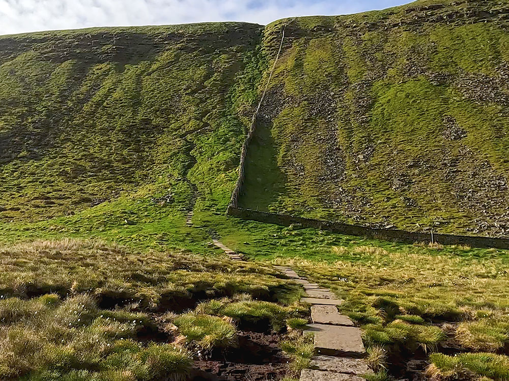 The zigzag path heading up the steep climb on Ingleborough