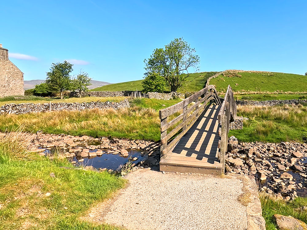 Wooden footbridge near Nether Lodge on the Yorkshire 3 Peaks Walk