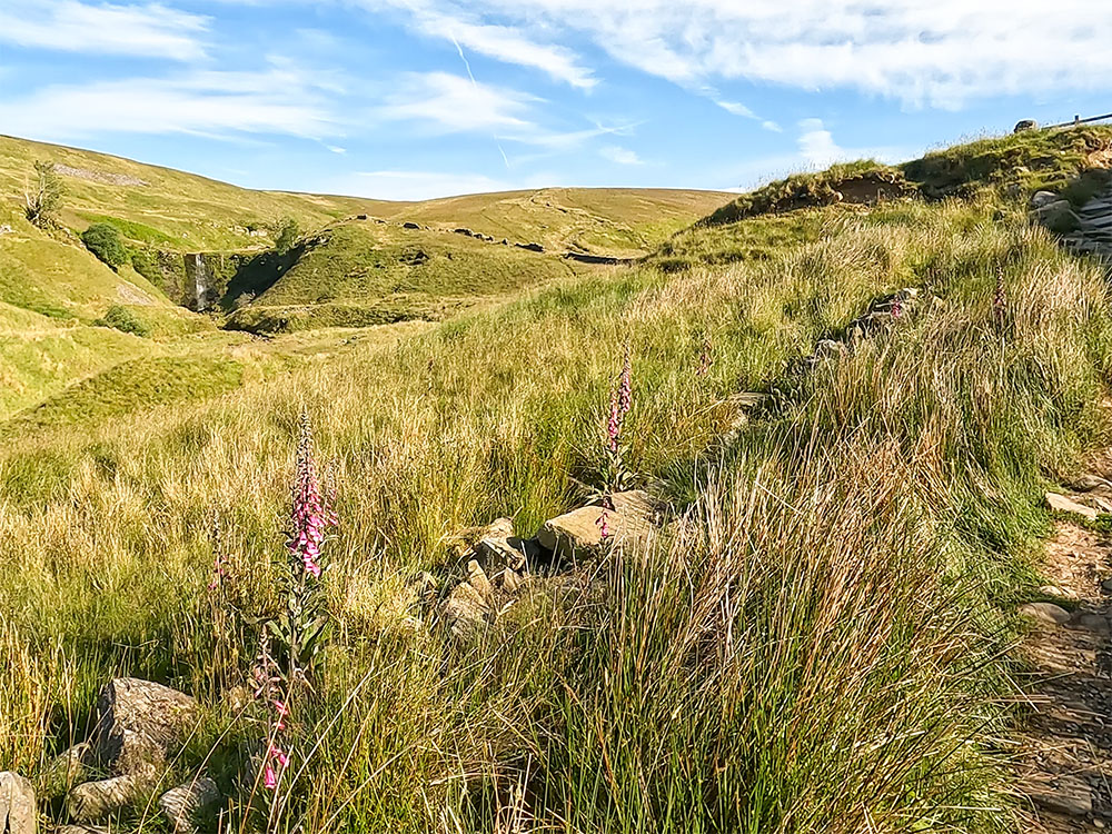 Looking towards Force Gill waterfall after a period of dry weather from the Yorkshire 3 Peaks path heading towards Whernside