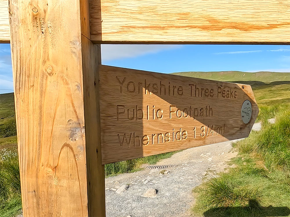Yorkshire Three Peaks Public Footpath sign pointing towards Whernside